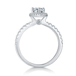 CARISSIE pear moissanite halo engagement ring, side profile revealing gallery stone and pavé band