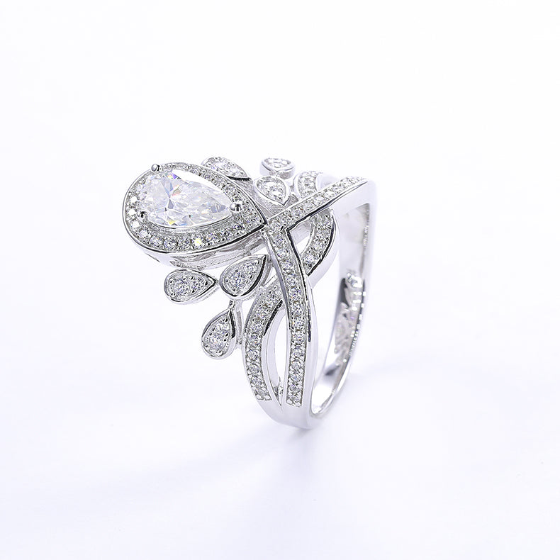 CARISSIE pear moissanite halo ring, three-quarter perspective of the classic white stone design with full pavé coverage