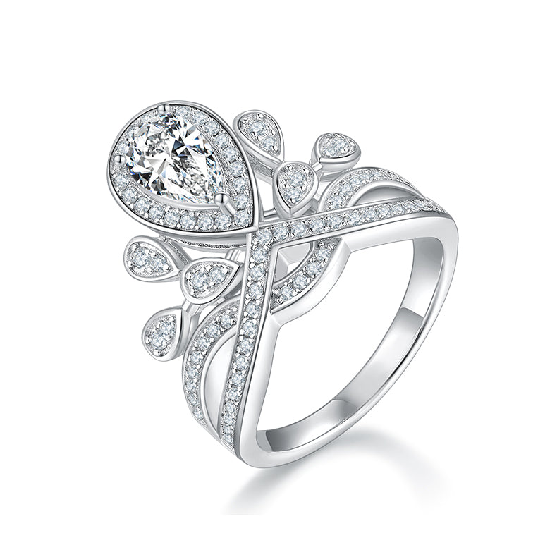 CARISSIE pear moissanite halo engagement ring, angled view highlighting the asymmetrical split shank and leaf motifs