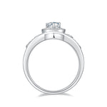 CARISSIE pear moissanite halo ring, bottom profile showing the smooth silver-tone interior of the band and setting height