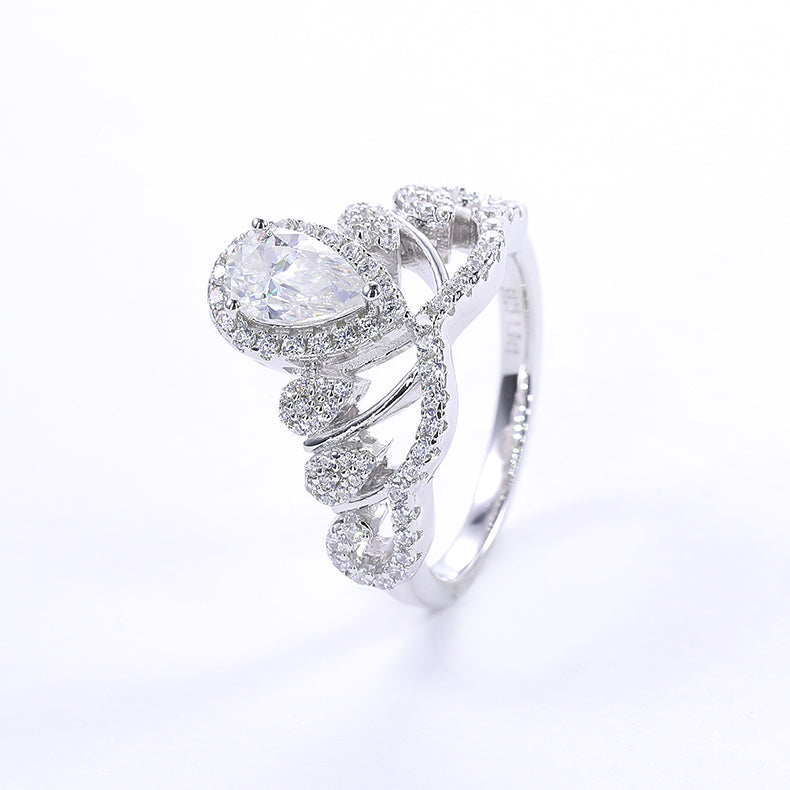 CARISSIE pear moissanite halo engagement ring, oblique view emphasizing the classic white color option and sculptural twisted band shape