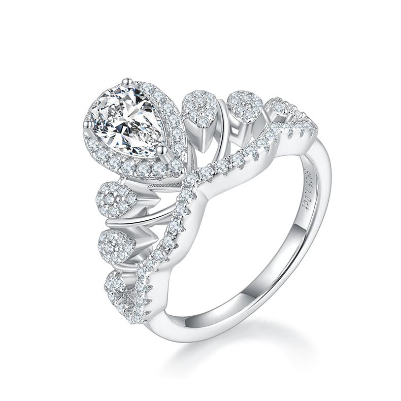 CARISSIE pear moissanite halo engagement ring, close-up side profile showing intricate openwork band and pavé stone details in white metal