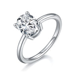 CARISSIE oval moissanite solitaire ring, angled view highlighting the high-polish silver band and four-prong setting