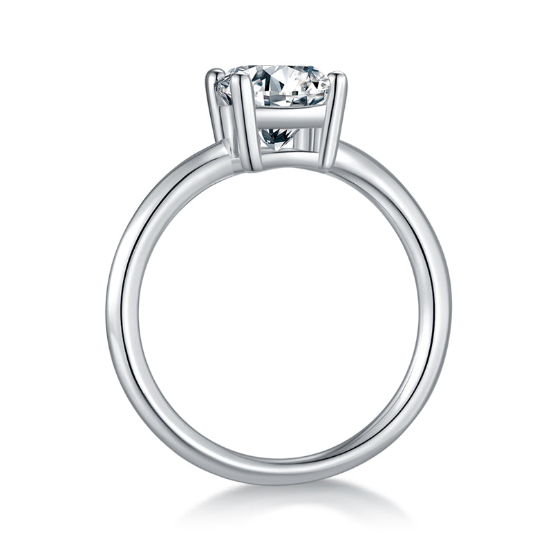 CARISSIE oval moissanite solitaire ring, side profile revealing the smooth circular band and height of the prong basket