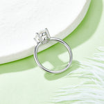 CARISSIE oval moissanite solitaire ring, top-down angle emphasizing the interior circle of the band and open gallery design