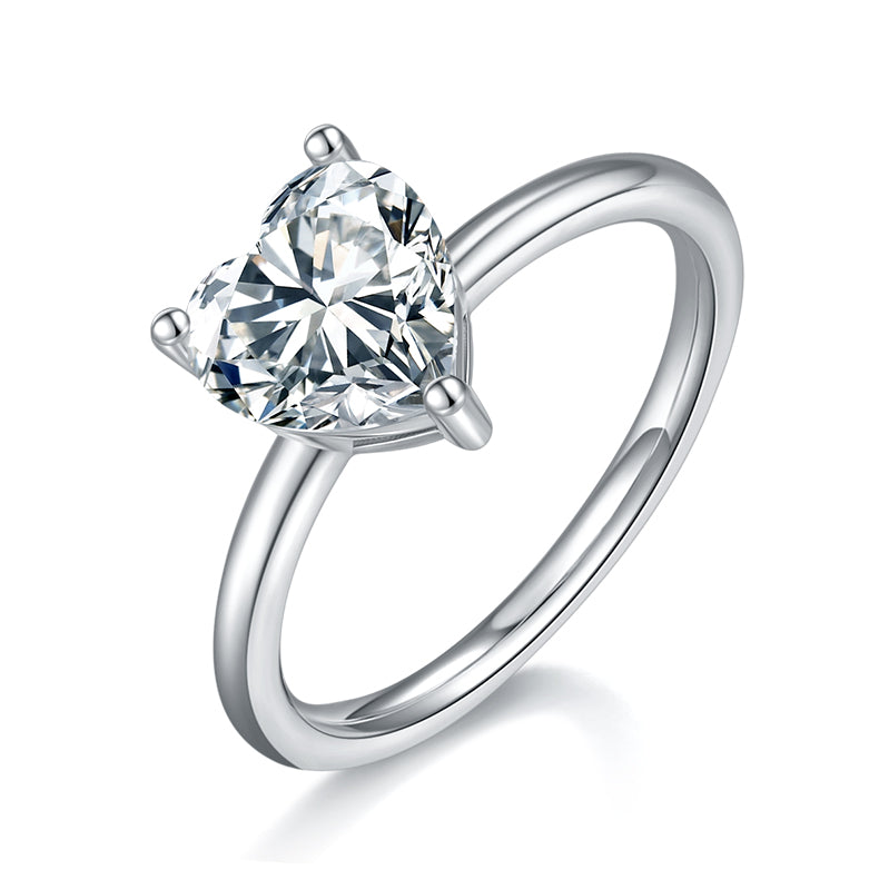 CARISSIE heart moissanite solitaire ring, angled view highlighting the three-prong setting and polished silver band