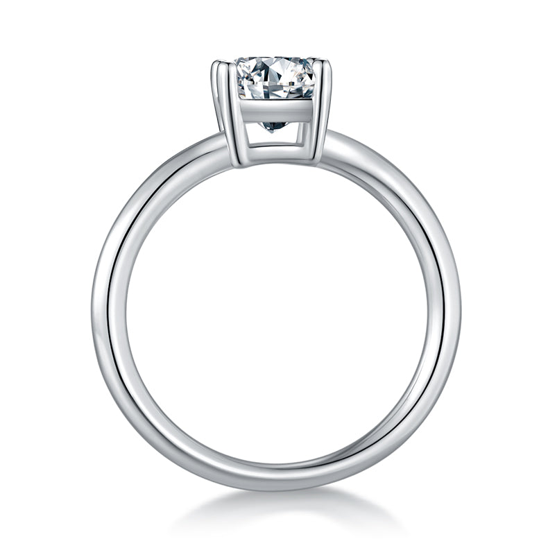 CARISSIE emerald cut moissanite solitaire ring, side profile revealing the smooth polished metal band and open gallery under the stone
