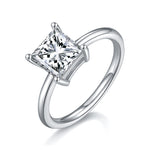 CARISSIE Princess Solitaire Engagement Ring, angled view showing square moissanite stone and sleek silver-tone band