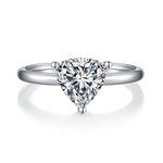 CARISSIE trillion solitaire engagement ring, front view showcasing the symmetrical cut of the center stone and rounded prongs