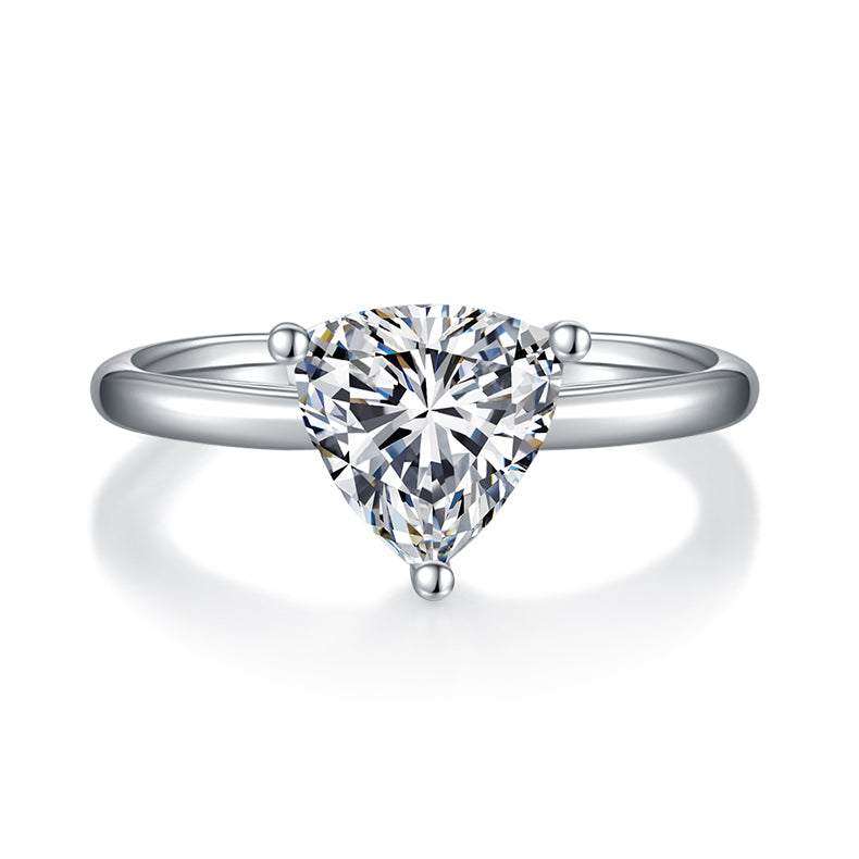 CARISSIE trillion solitaire engagement ring, front view showcasing the symmetrical cut of the center stone and rounded prongs