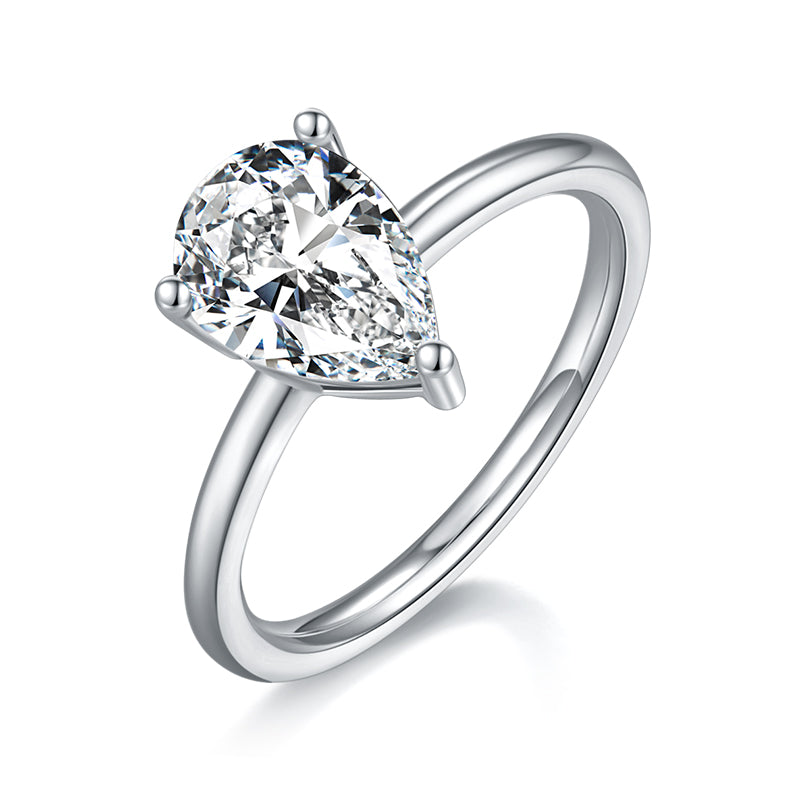 CARISSIE pear moissanite solitaire ring, angled view highlighting the brilliant cut stone and sleek silver-tone band