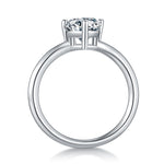 CARISSIE pear moissanite solitaire ring, side profile revealing the polished metal shank and elevated prong structure