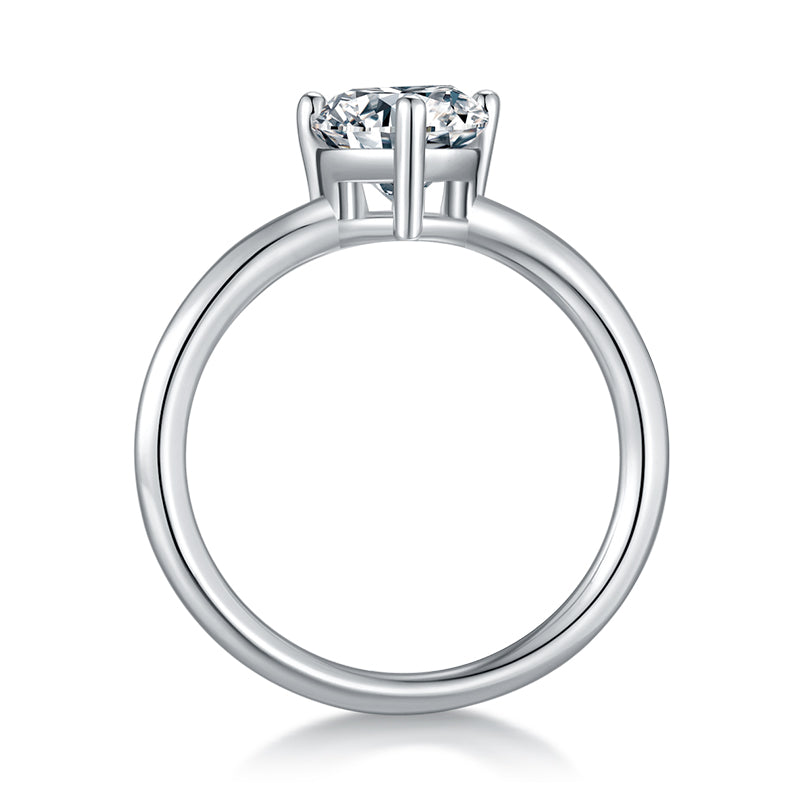 CARISSIE pear moissanite solitaire ring, side profile revealing the polished metal shank and elevated prong structure