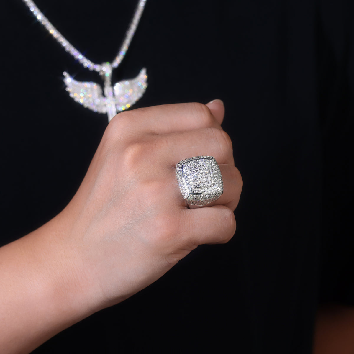 CARISSIE round moissanite statement ring worn on a hand, showcasing the bold size and sparkle against a dark background