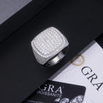CARISSIE cushion moissanite statement ring resting on black box next to GRA certification card for authenticity verification