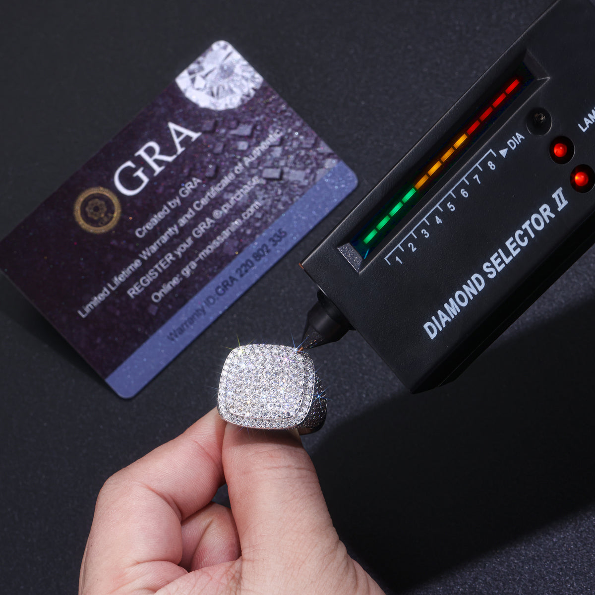 CARISSIE cushion moissanite statement ring being tested with diamond selector tool confirming thermal conductivity properties
