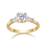Alexis Round Moissanite Three Stone Engagement Ring in 18K yellow gold plating