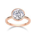 Alice Round Moissanite Bezel Engagement Ring in 18K rose gold plating, front view