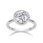 Alice Round Moissanite Bezel Engagement Ring in 18K white gold plating, front view