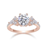 Amber Round Moissanite Side Stone Engagement Ring in 18K rose gold plating, front view