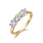 Andrea Round Moissanite Three Stone Engagement Ring in 18K yellow gold plating
