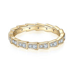 Brynn Moissanite Segmented Half Eternity Band in 18K yellow gold plating, angled view
