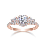 Camellia Round Moissanite Floral Halo Engagement Ring in 18K rose gold plating, front view