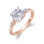 Cassia Round Moissanite Side Stone Engagement Ring in 18K rose gold plating