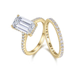 Cecilia Emerald Cut Moissanite Hidden Halo Bridal Set in 18K yellow gold plating, angled view