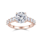 Charlotte Round Moissanite Side Stone Engagement Ring in 18K rose gold plating, front view