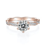 Clarissa Round Moissanite Twist Engagement Ring in 18K rose gold plating, front view