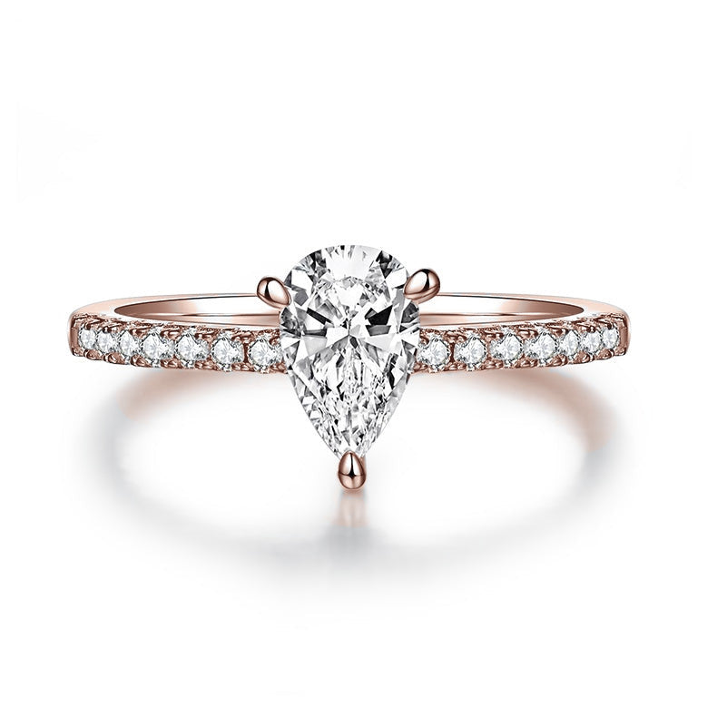 Edith Pear Moissanite Pavé Engagement Ring in 18K rose gold plating, front view