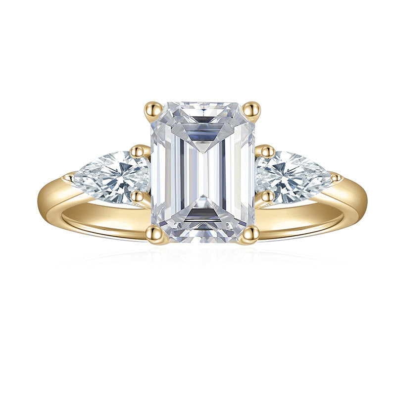 Eleanor Emerald Cut Moissanite Three Stone Engagement Ring in 18K yellow gold plating, front view