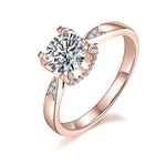 Eliana Round Moissanite Hidden Heart Engagement Ring in 18K rose gold plating, angled view