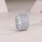 Harriet Moissanite Wide Pavé Eternity Band in 18K white gold plating, angled view