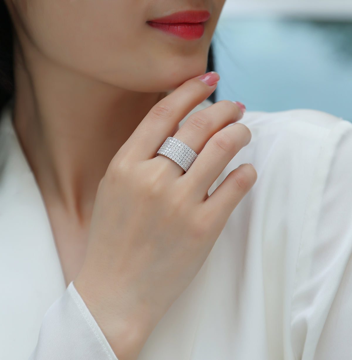 Harriet Moissanite Wide Pavé Eternity Band in 18K white gold plating, worn on the hand