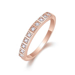 Imani Round Moissanite Bezel Half Eternity Band in 18K rose gold plating