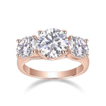 Isabel Round Moissanite Three Stone Engagement Ring in 18K rose gold plating, front view