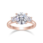Katrina Round Moissanite Three Stone Engagement Ring in 18K rose gold plating, front view