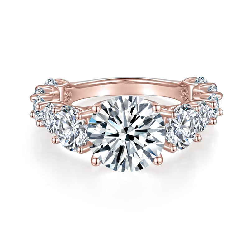 Liv Round Moissanite Graduated Side Stone Engagement Ring in 18K rose gold plating, front view