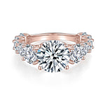 Liv Round Moissanite Graduated Side Stone Engagement Ring in 18K rose gold plating, front view