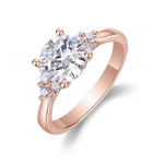 Melody Round Moissanite Side Stone Engagement Ring in 18K rose gold plating