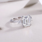 Carissie Classic Emerald Cut Three-Stone Engagement Ring