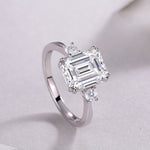 Carissie Classic Emerald Cut Three-Stone Engagement Ring