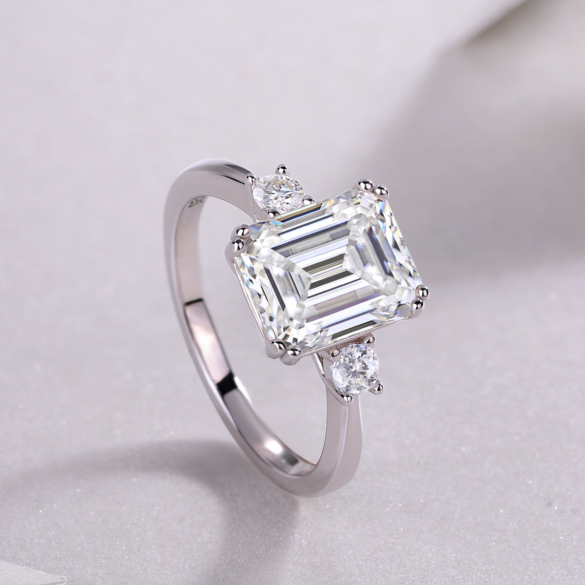 Carissie Classic Emerald Cut Three-Stone Engagement Ring