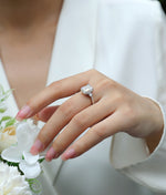 Carissie Classic Emerald Cut Three-Stone Engagement Ring