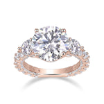 Miranda Round Moissanite Three Stone Engagement Ring in 18K rose gold plating, front view