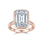 Petra Emerald Cut Moissanite Bezel Engagement Ring in 18K rose gold plating, front view