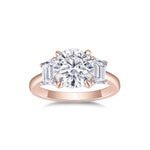 Sylvie Round Moissanite Three Stone Engagement Ring in 18K rose gold plating, front view