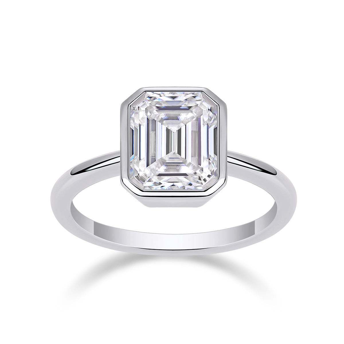 Thea Emerald Cut Moissanite Bezel Engagement Ring in 18K white gold plating, front view